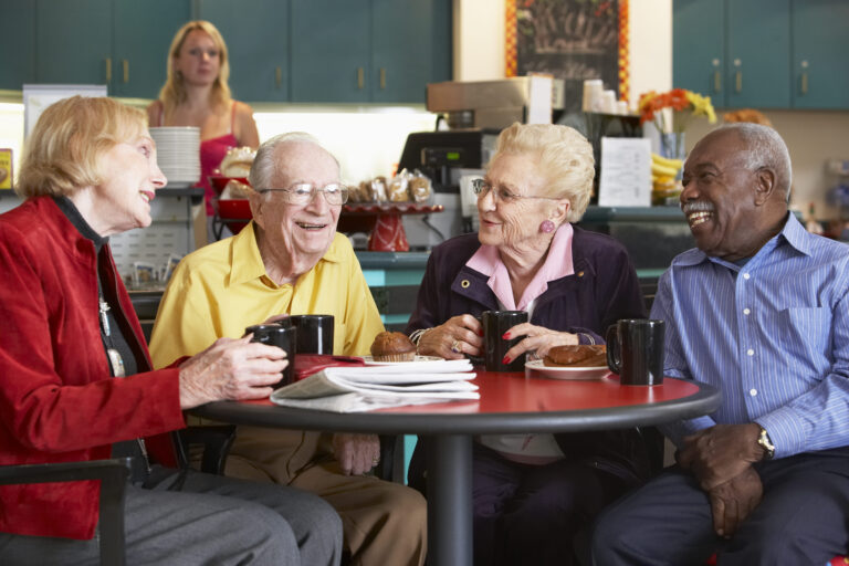 senior adults having morning tea together